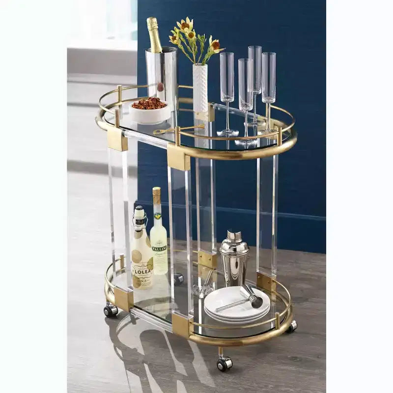 55 Downing Street Adaline 29 1/2 Wide Clear Acrylic and Gold Oval Bar Cart